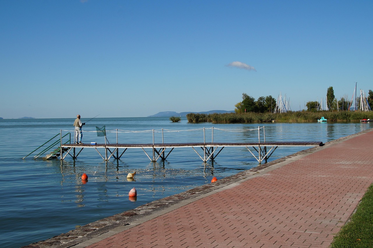 Angler on a jetty beside Lake Balaton